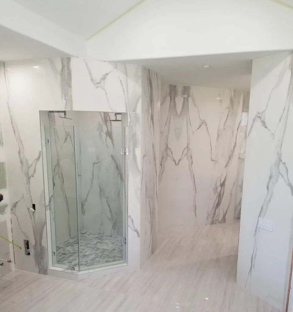 Bathroom remodeling with updated tub surround, tile, and coordinated finishes