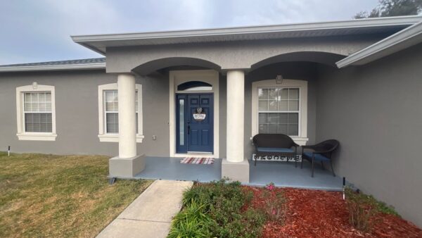 Front entry refresh with painted exterior walls, columns, and improved curb appeal