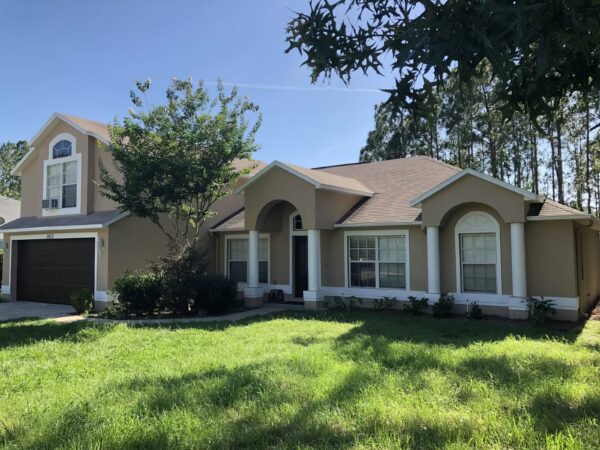 Exterior home elevation with refreshed facade and finished front approach