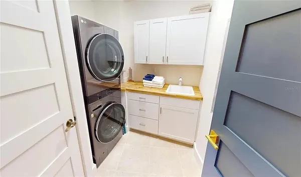 Laundry room upgrade with built in cabinets, storage, and updated work surface