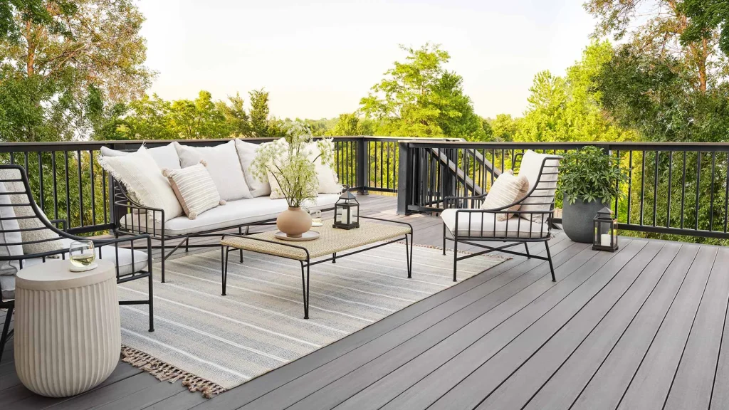 Outdoor living space upgrade with new decking, railing, and lounge area styling
